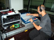 sound technician at mixing desk